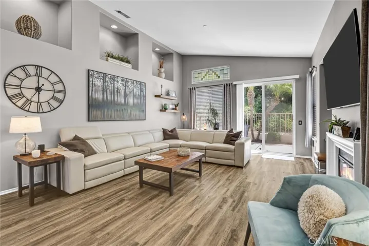 Spacious Family Room with Wood-like Flooring, High Ceilings