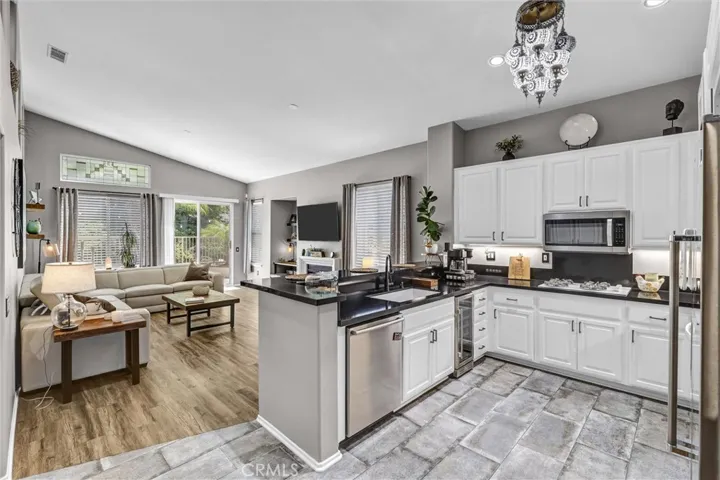 Kitchen with Silas Stone Counters, tile flooring and newer cabinets