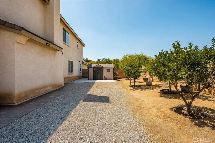 Sideyard (West) leading to Storage Shed and Potential RV Access.