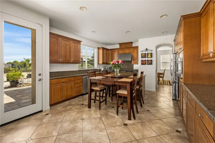 Kitchen View from Family Room, with Backyard Door.