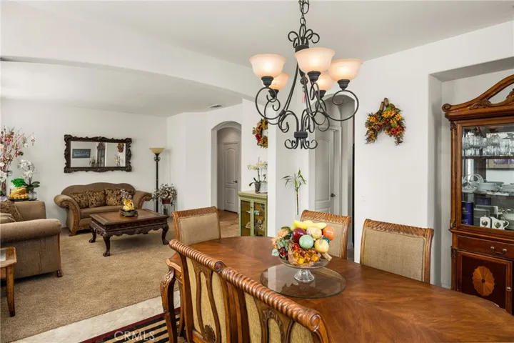 View from Formal Dining Room to Living Room & Kitchen.