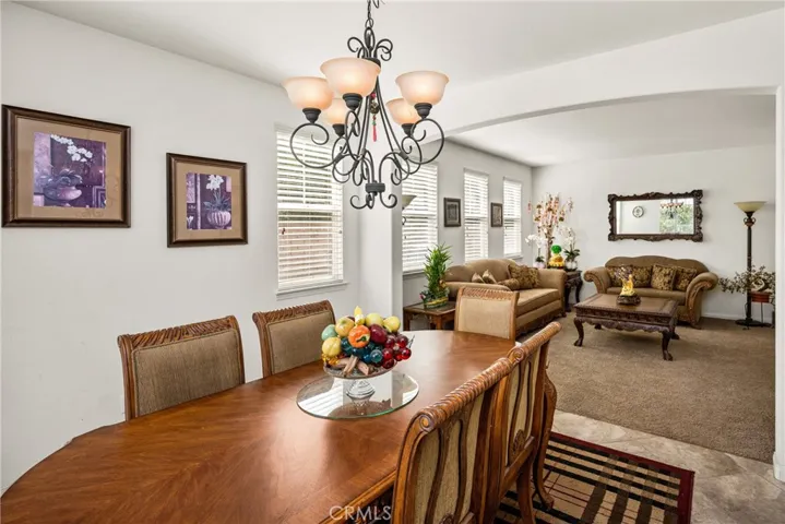 Formal Dining Room opens up to Living Room.