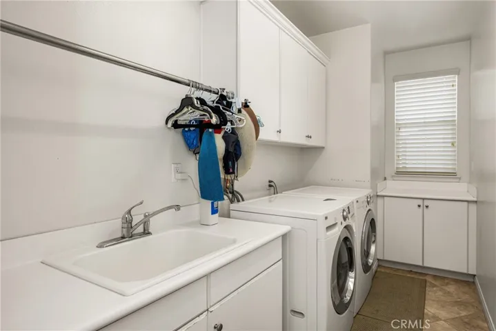 Downstairs Laundry Room with Sink & Storage.
