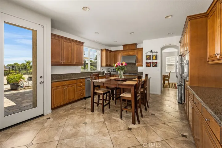 Kitchen View from Family Room, with Backyard Door.