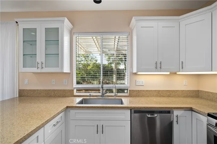 The kitchen has stainless steel appliances