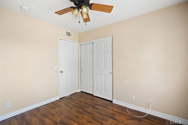 This secondary bedroom also has its own ceiling fan