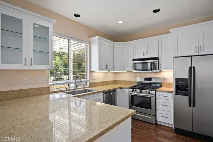 Here is a look of the remodeled kitchen with granite countertops. You even have an amazing view fro the kitchen sink