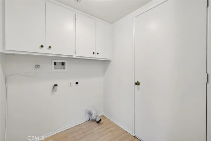 Washer and Dryer Hookups in the Laundry Room just inside the garage before you step into the kitchen.