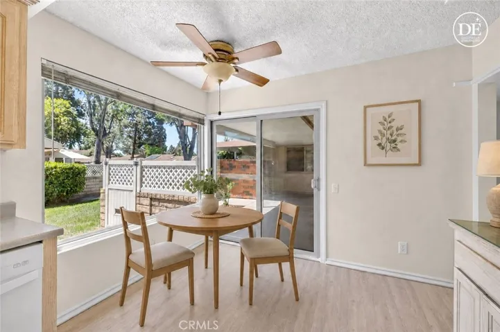 Digitally Enhanced Sitting area inside the kitchen leading out the paito.