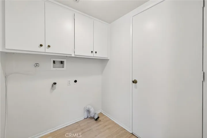Washer and Dryer Hookups in the Laundry Room just inside the garage before you step into the kitchen.