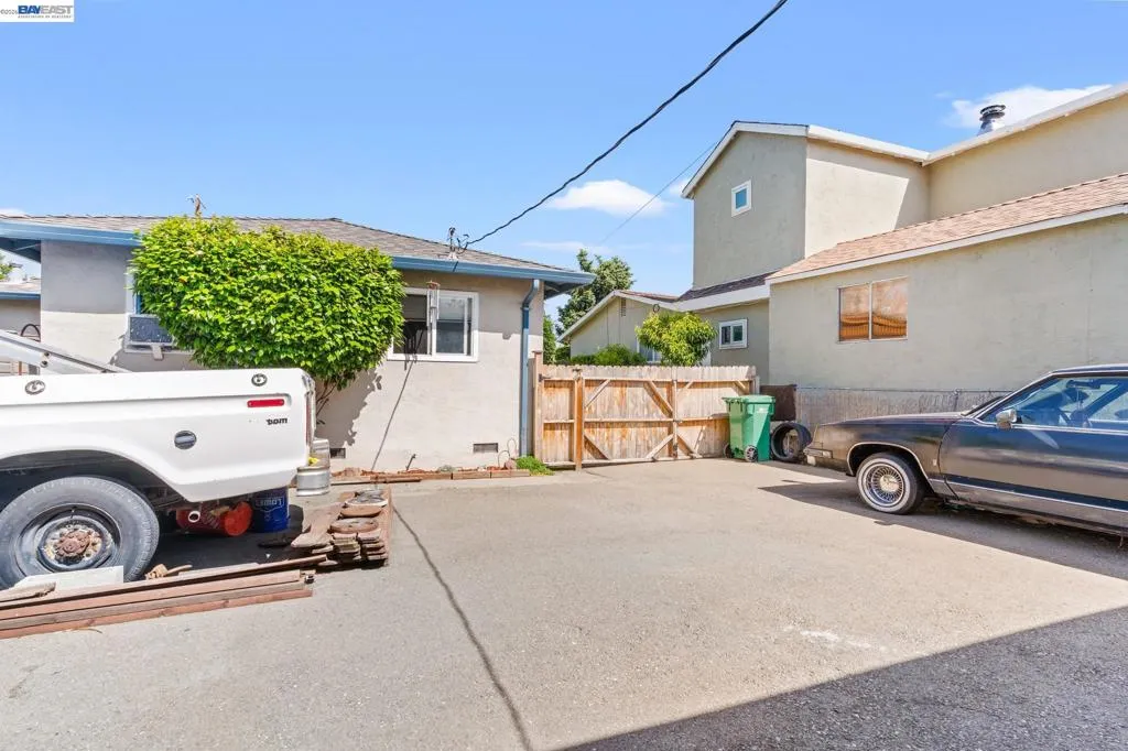 Parking or Play Area in front of 1253 Bellina. View of the Back of House for 1251 Bellina