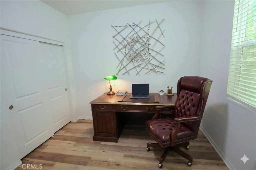 Main floor bedroom AI staged as an office