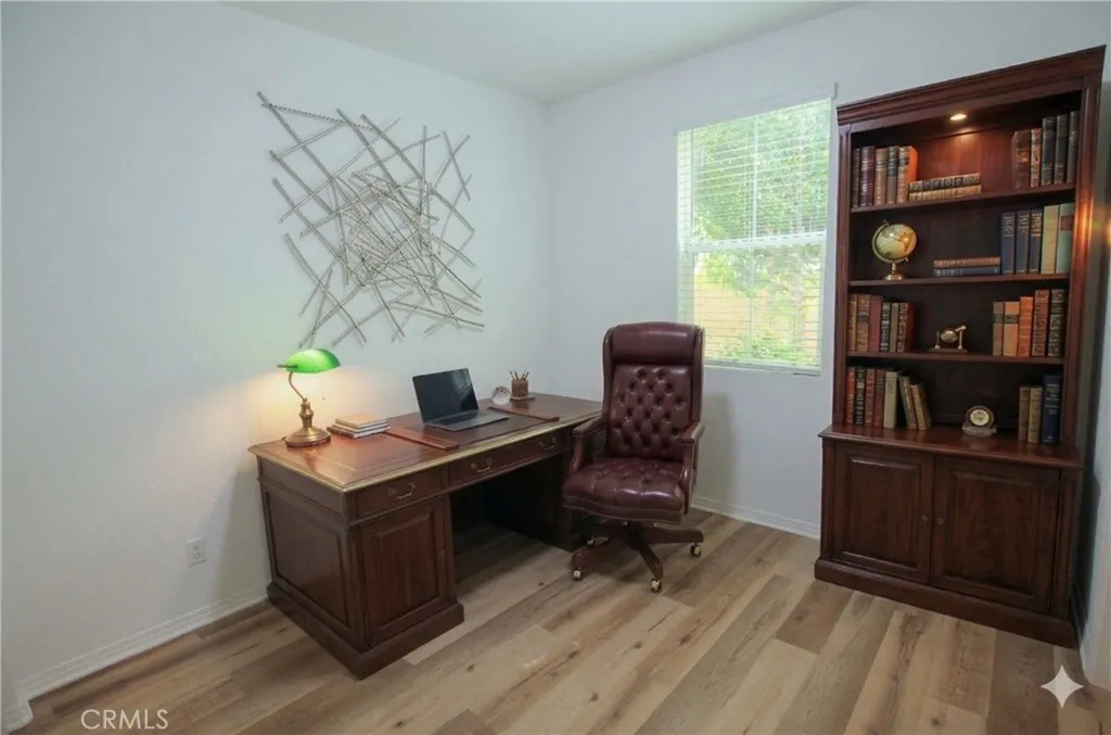 Main floor bedroom AI staged as an office