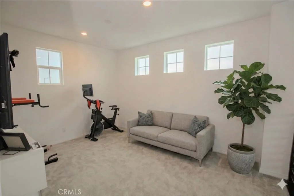 Loft area with AI staged sofa & tree