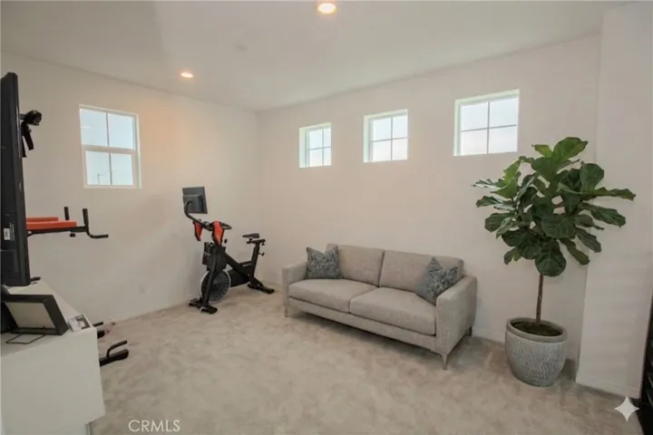 Loft area with AI staged sofa & tree