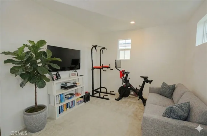 Loft area with AI staged sofa & tree