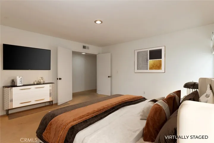 VIRTUALLY STAGED different angle of primary bedroom