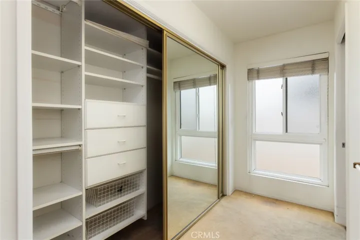 Primary dressing area leading to private bathroom