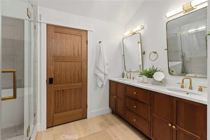 Primary double sink and closed door water closet