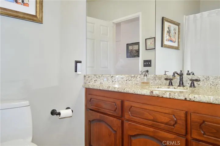 The 3rd Full Bath is on the Main Floor and Offers a Granite-Topped Vanity, Engineered Hardwood Flooring, New Lighting and a Tub/Shower Combo