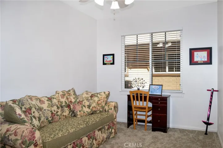 The 5th Bedroom/Den is on the Main Floor Near the 3rd Full Bath and was a Builder Option for this Plan. It Offers Plush Carpeting and a Ceiling Fan, but Does Not Have a Closet.