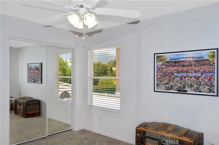 The 2nd Bedroom is Upstairs Next to the 2nd Bath and Offers More Luxurious Carpeting, a Ceiling Fan, and Mirrored Wardrobe Doors