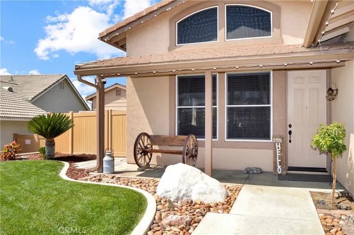Inviting covered front porch with holiday lights on timers already installed for you