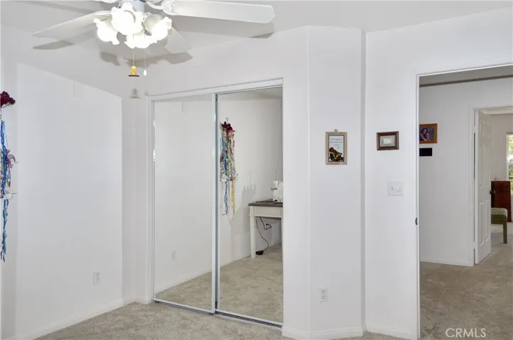 The 3rd Bedroom is Upstairs Next to the 2nd Bedroom and Offers More Luxurious Carpeting, a Ceiling Fan, and Mirrored Wardrobe Doors
