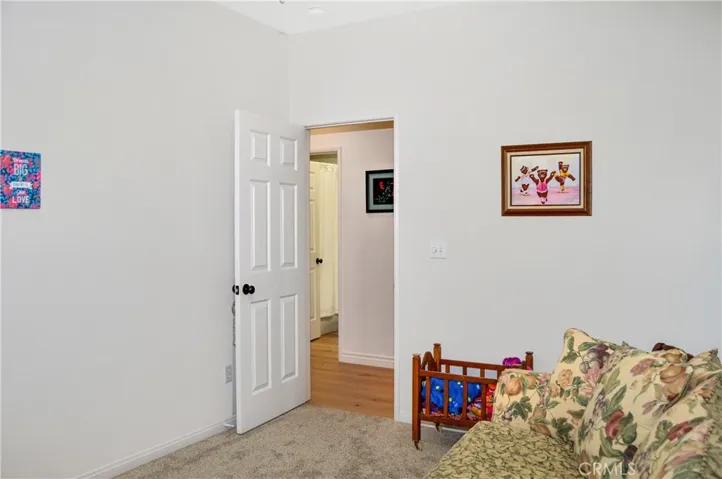 The 5th Bedroom/Den is on the Main Floor Near the 3rd Full Bath and was a Builder Option for this Plan. It Offers Plush Carpeting and a Ceiling Fan, but Does Not Have a Closet.