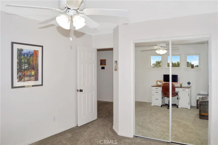 The 2nd Bedroom is Upstairs Next to the 2nd Bath and Offers More Luxurious Carpeting, a Ceiling Fan, and Mirrored Wardrobe Doors