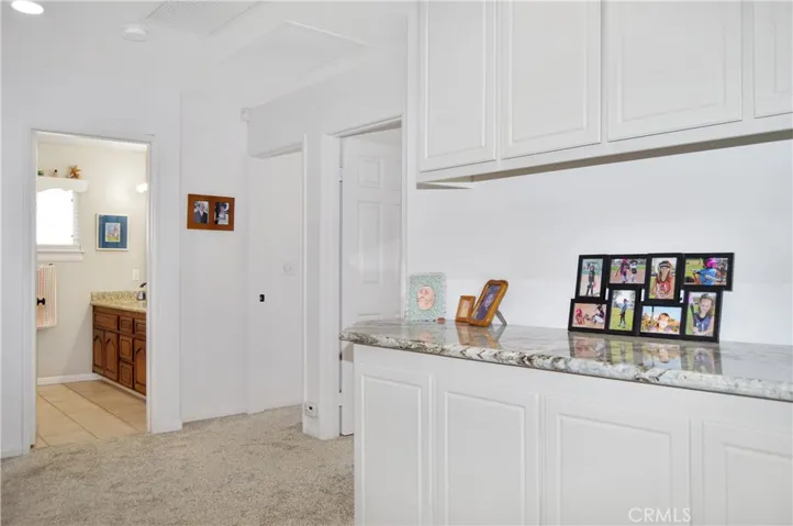 The Upstairs Hall Offers Granite Counters for the Linen Cabinets. The 2nd Full Bath and the 2nd and 3rd Bedrooms are Ahead