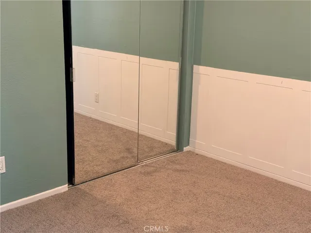 2nd bedroom with glass sliding closet doors