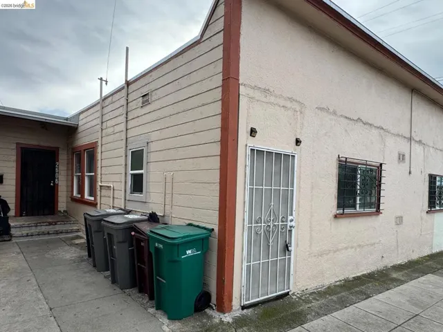 View of side of home with stucco siding