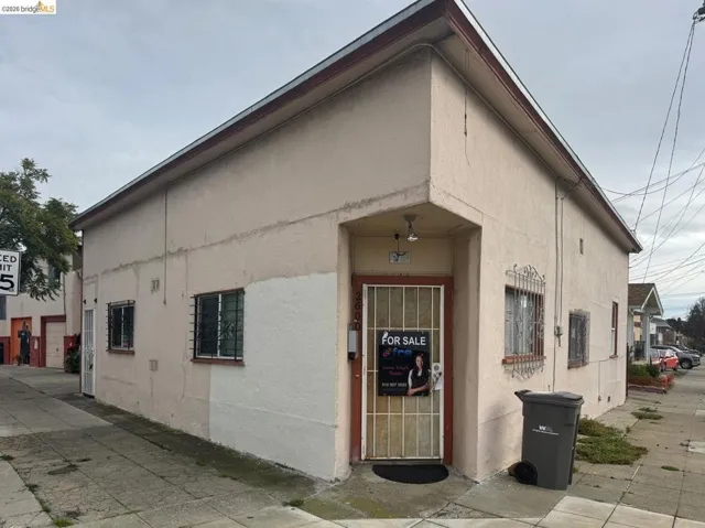 View of building exterior featuring a garage