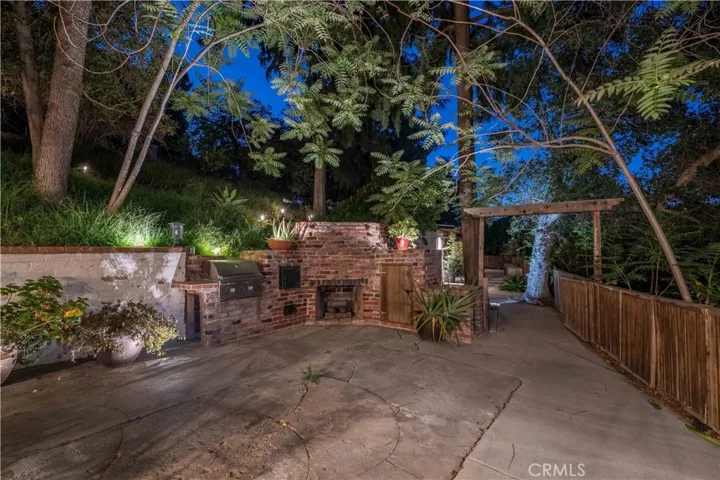 Back Patio With BBQ and Paths to Horse Stalls and Enchanted Pathways