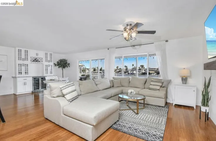 Open-concept living space with wood-finish flooring