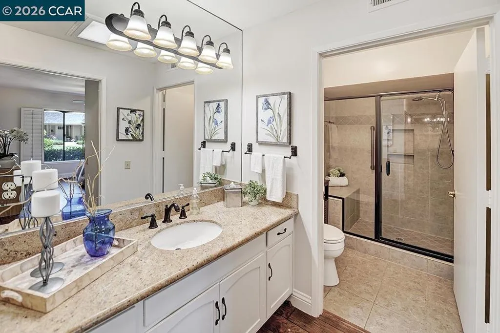 large vanity with updated fixtures and counter top