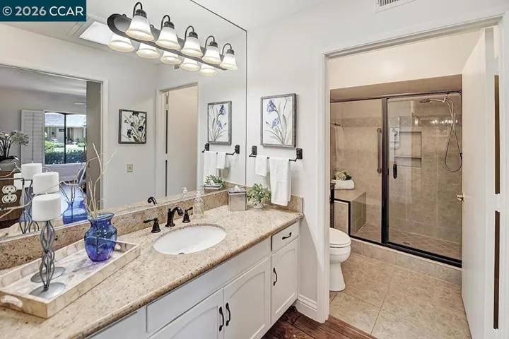 large vanity with updated fixtures and counter top