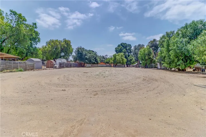 View of the back lot looking from the horse stalls south.
