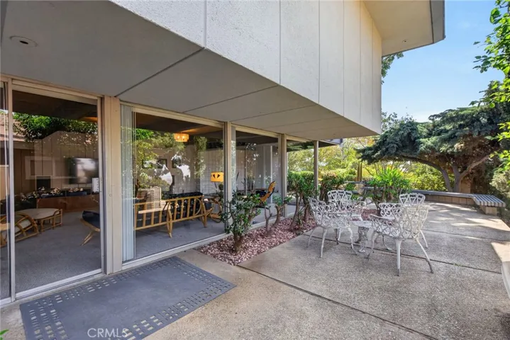 Private sliders into rumpus room and side orchard of varitey fruit trees
