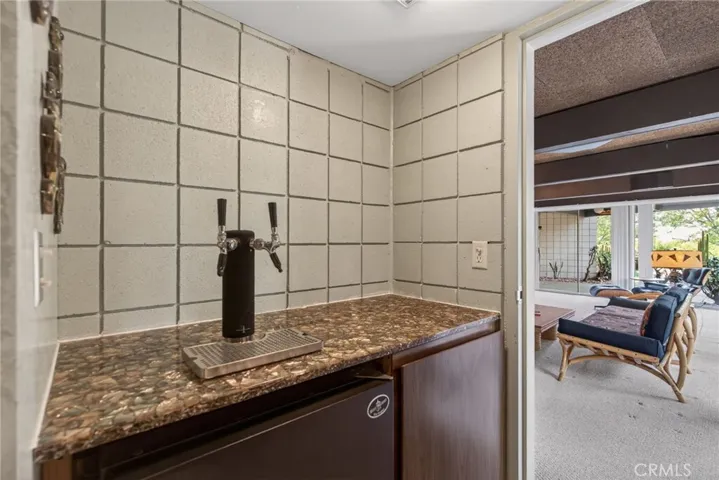 kegarator and cellar area to the left along with shower/bathroom