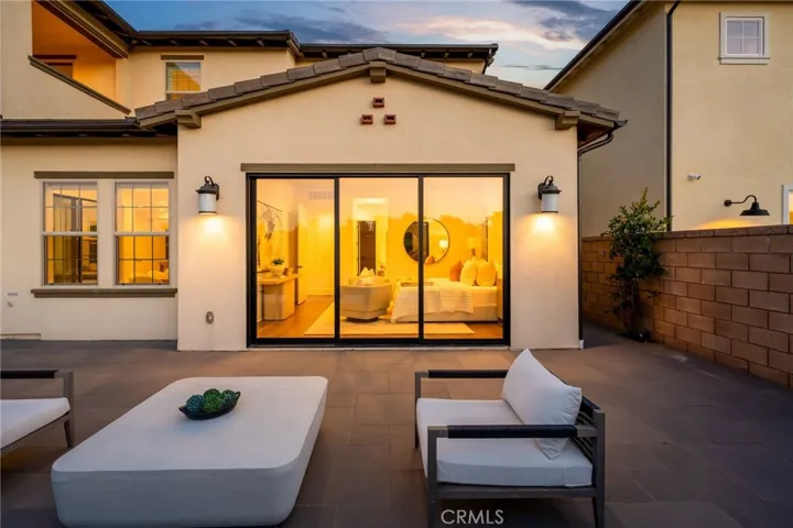Backyard Twilight Looking into Primary Suite Entrance