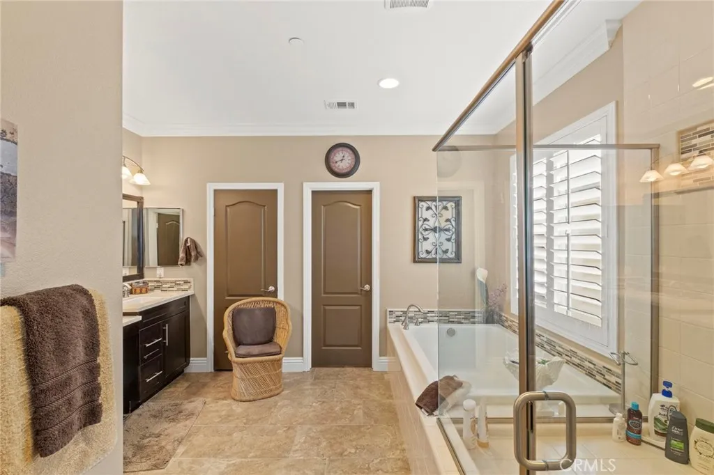 Main bathroom with shower and soaking tub
