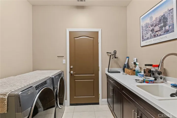 Inside laundry room with sink