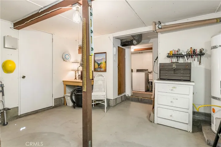 Workshop with laundry under house