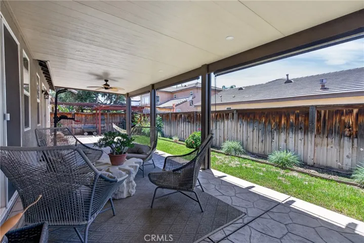 back covered patio with intstalled sun shades