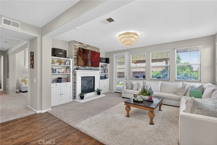 living space off of kitchen with dual sided  fireplace