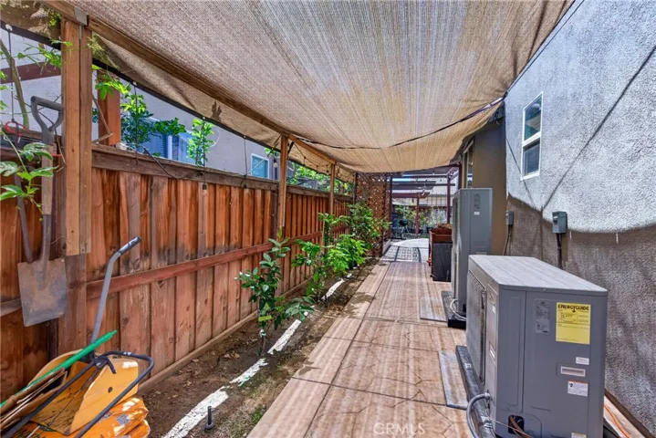 left side outdoor space showing brand new A/C unit