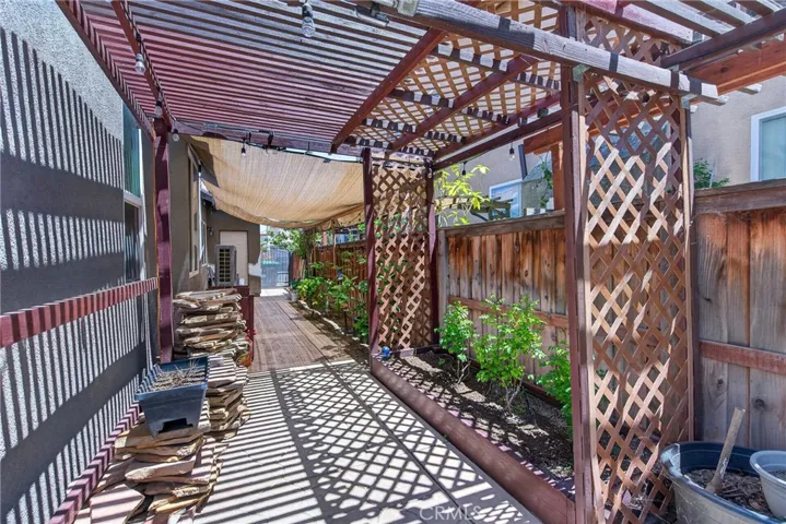 looking down left side of home with fruit trees
