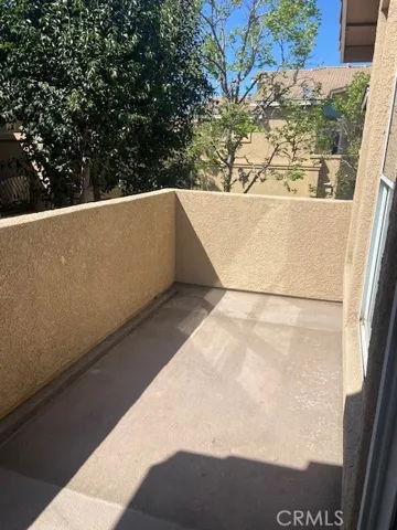 Private Balcony for BBQ, Relaxing, and Potted Plants.